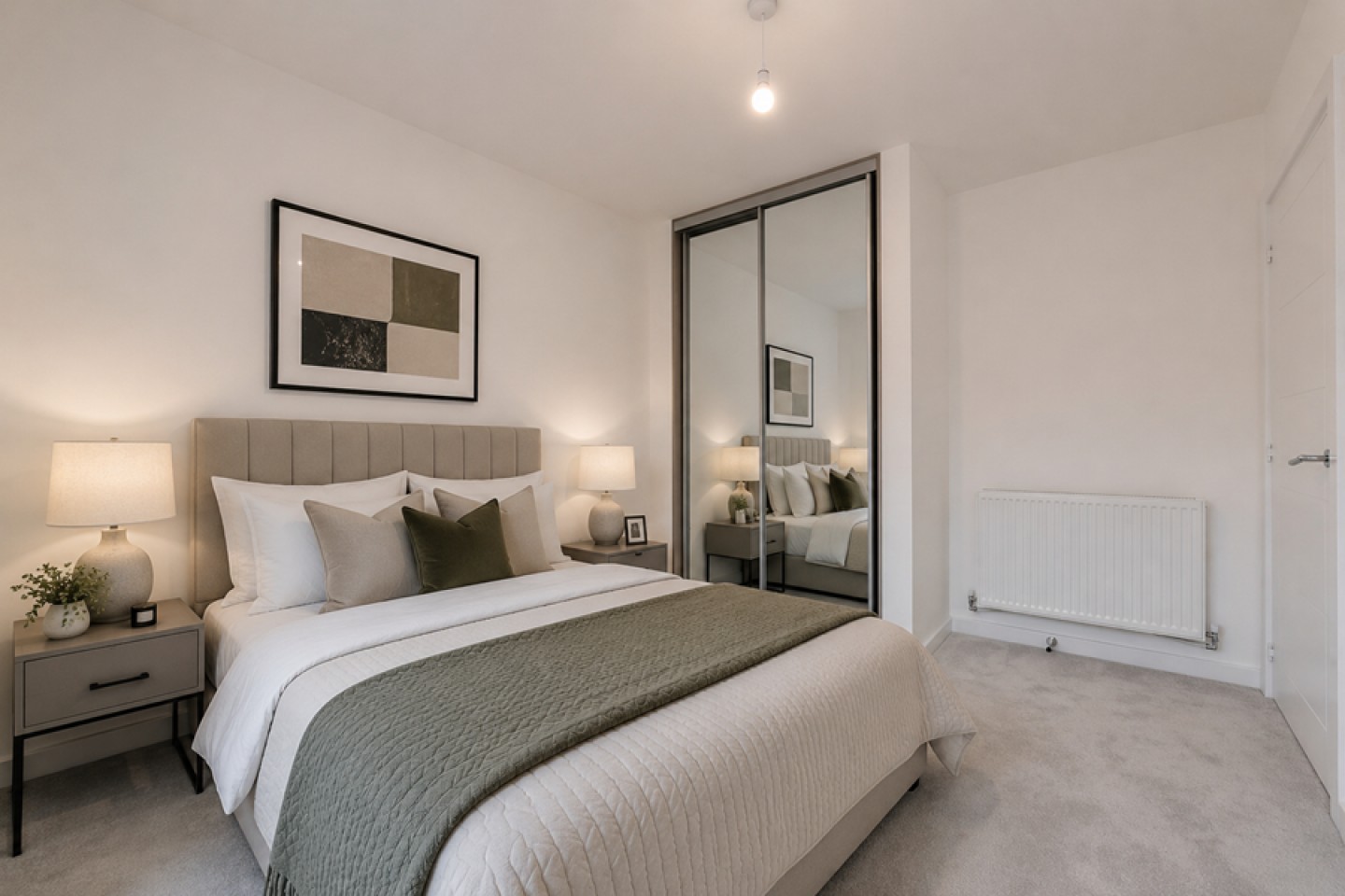 Master bedroom with a built in mirrored wardrobe with neutral decor